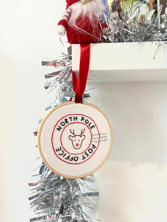North pole stamp Christmas bauble/decoration. Hand embroidered. Wooden hoop