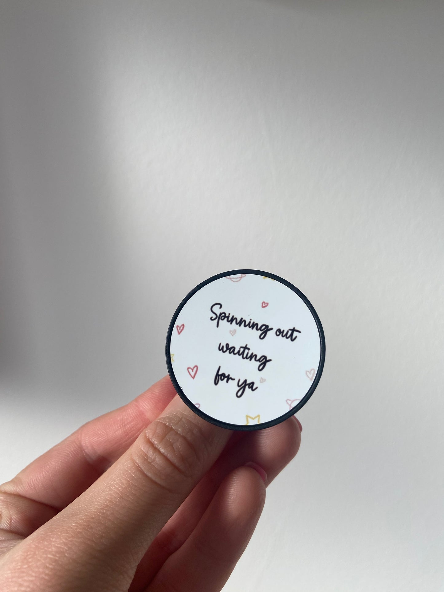Harry, “spinning out waiting for ya” phone pop socket. HSLOT