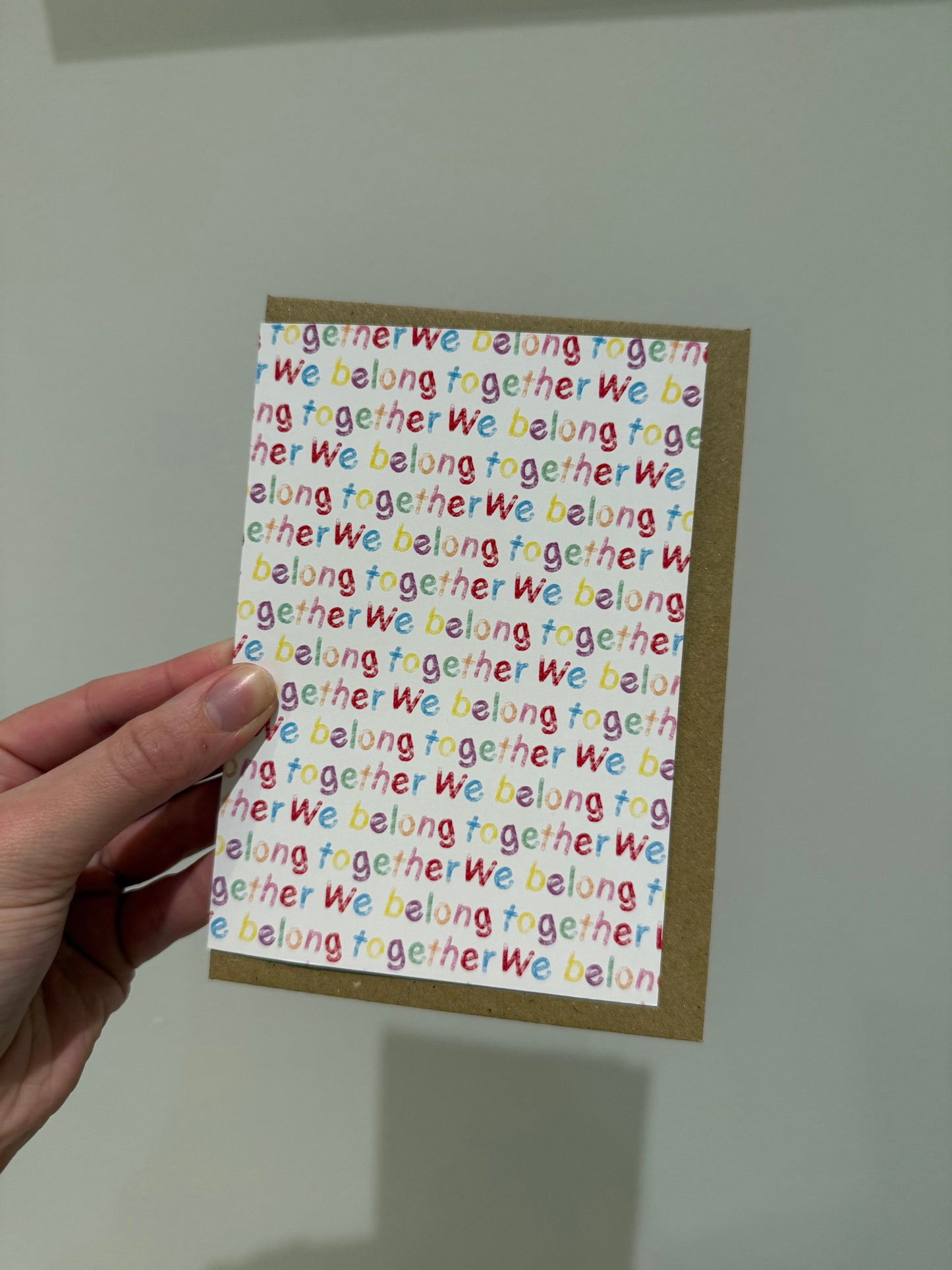 “We belong together”. A6. Multi coloured writing