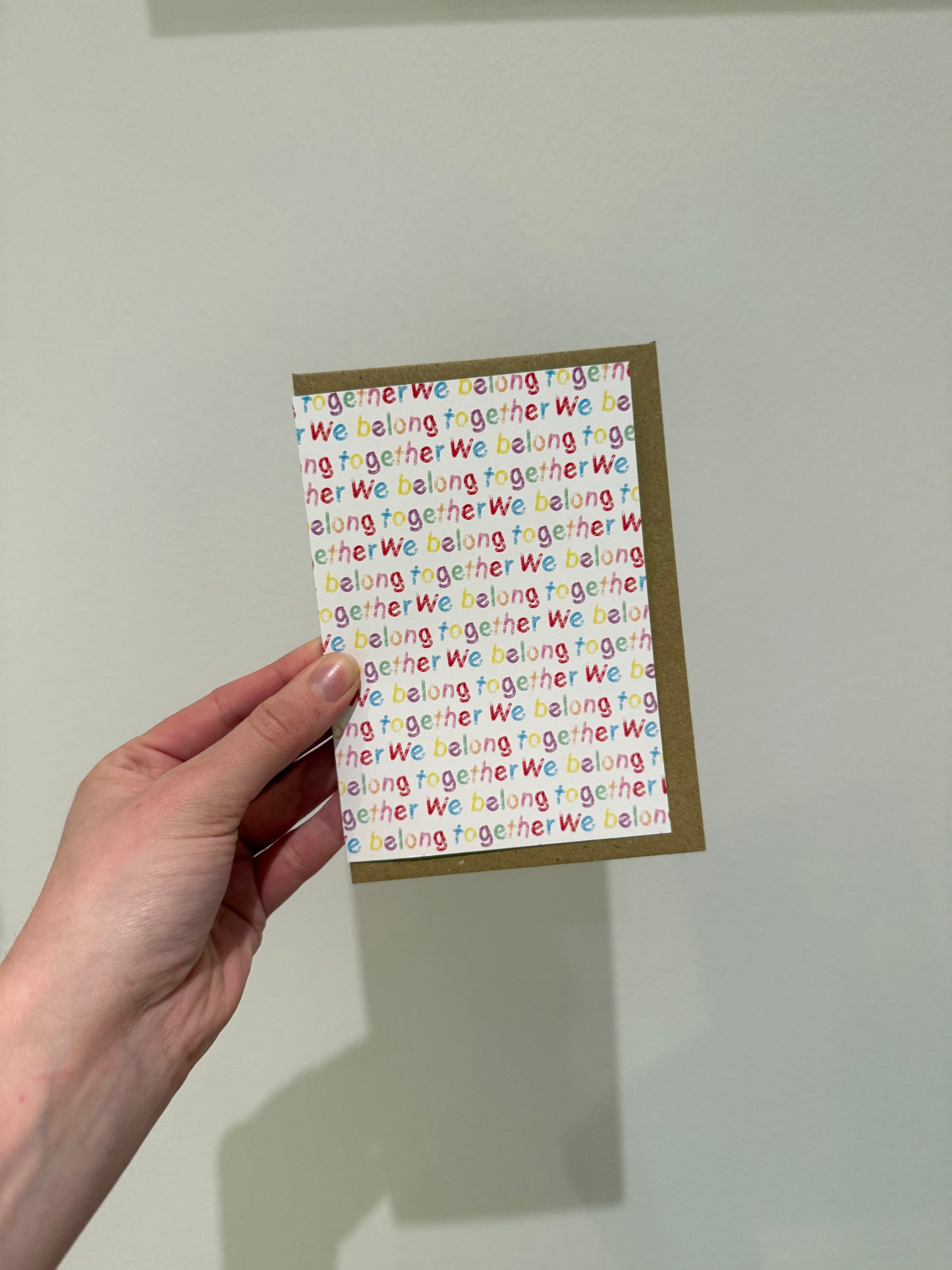 “We belong together”. A6. Multi coloured writing