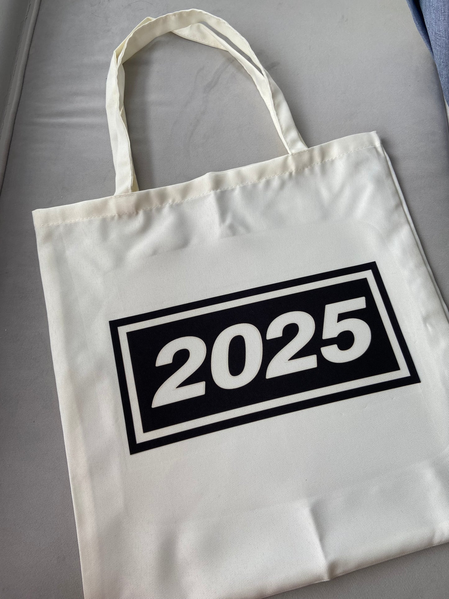 Oasis live 2025 tote bag. Cream