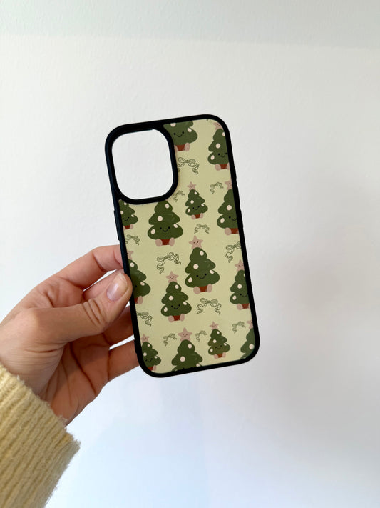 Christmas tree phone case. Green background. Cuddly toys.