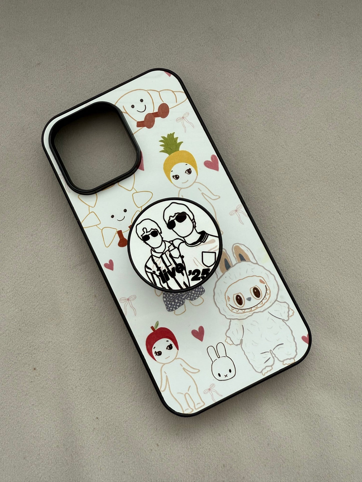 Live ‘25 phone pop socket. Liam and Noel
